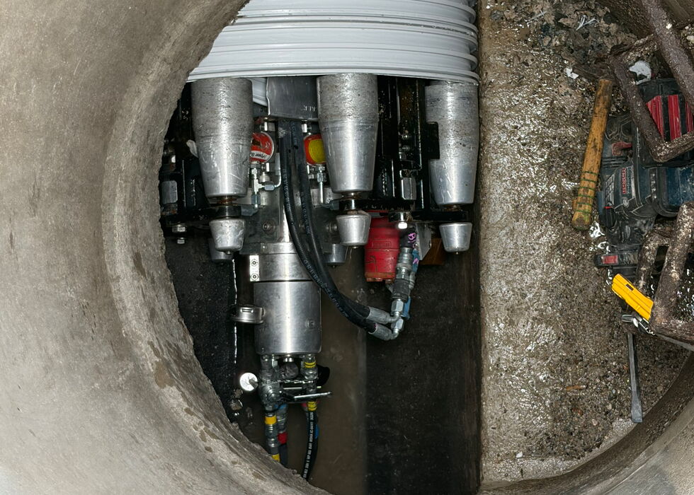 View into a round existing shaft with a coiled pipe system
