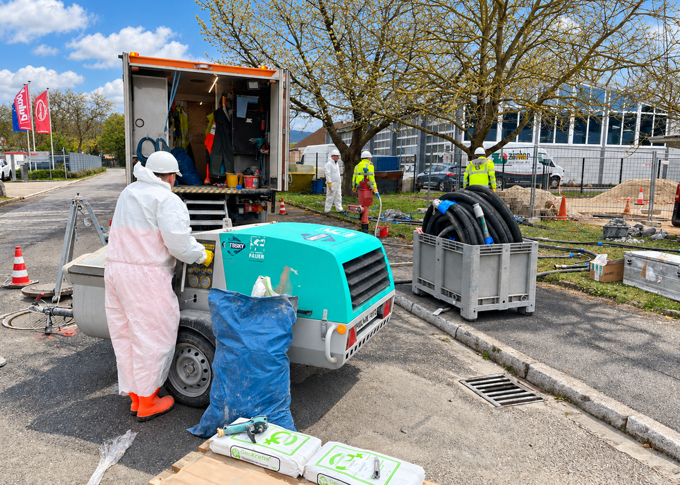 A worker in protective gear operates the Prestige 300 to prepare the material.