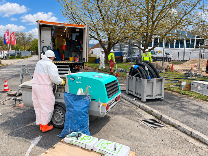 A worker in protective gear operates the Prestige 300 to prepare the material.